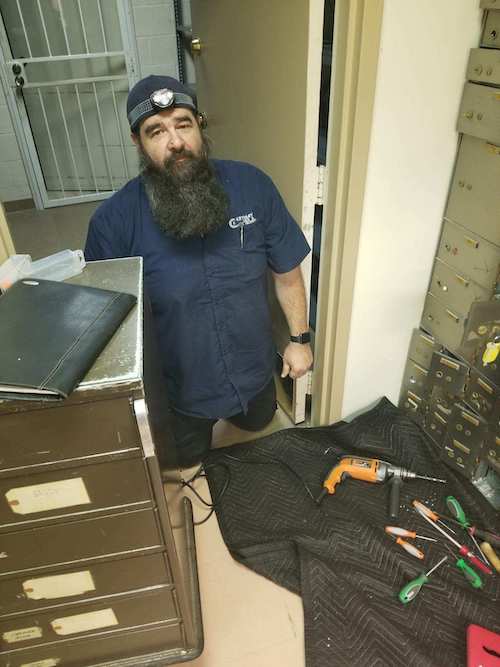 safe technician drilling safety deposit box locks