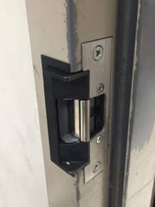 Electric strike installed into a metal frame in Chicago by Keyway Security